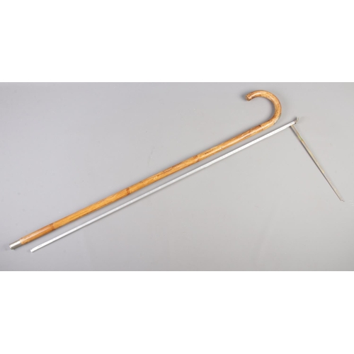 75 - A white metal topped bamboo walking stick, containing horse measurer.