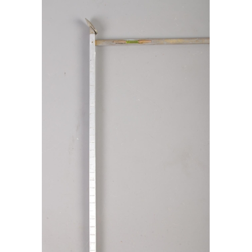 75 - A white metal topped bamboo walking stick, containing horse measurer.