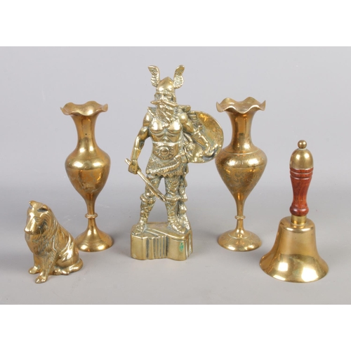 98 - A collection of brass items. Includes cast Viking, dog, pair of vases and a bell.