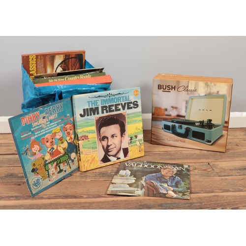 244 - A quantity of LP vinyl records & a Bush classic turntable. (boxed)