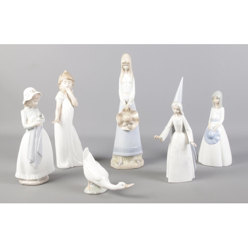 82 - Six porcelain figures. Includes one Lladro, three Nao etc.