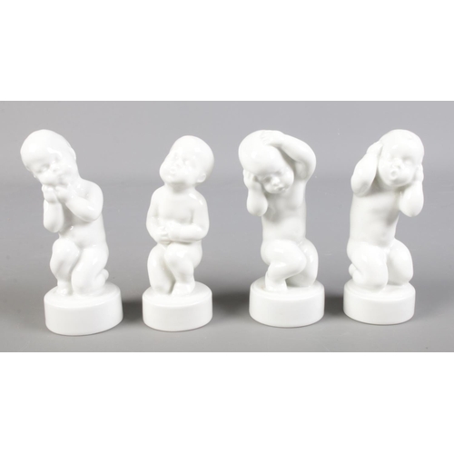 125 - Five Danish B&G (Bing & Grøndahl) porcelain figures of cherubs in various poses. To include the four... 