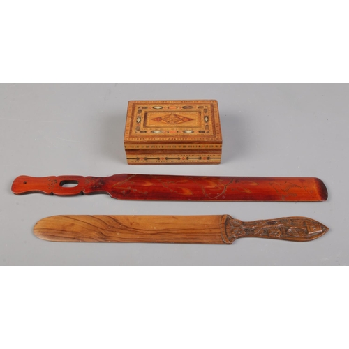 132 - Two decorative wooden page turners and marquetry box. To include Bamboo and Maple page turners with ... 