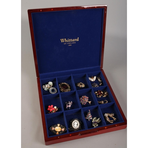 100 - A Whittard of Chelsea display box with contents of costume jewellery brooches.