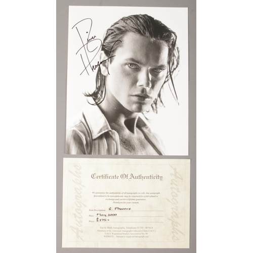 152 - An autograph monochrome photograph of River Phoenix with certificate of authenticity.