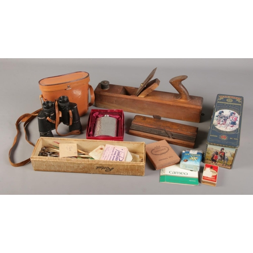 216 - A box of miscellaneous. Includes Zenith binoculars, hip flask, wood working tools etc.