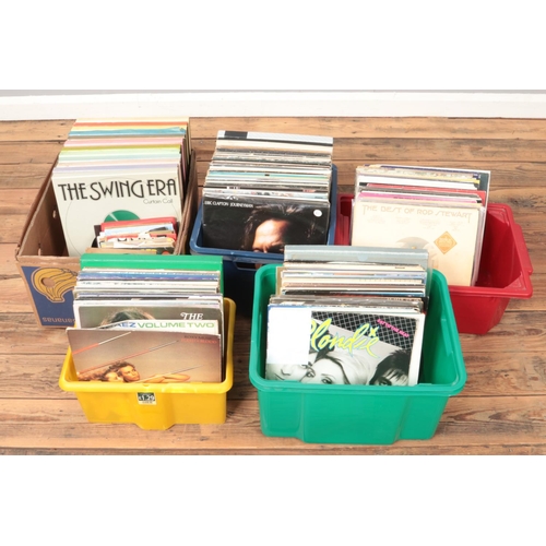 220 - Five boxes of LP and single records. Includes Blondie, Eric Clapton, The Swing Era box sets etc.