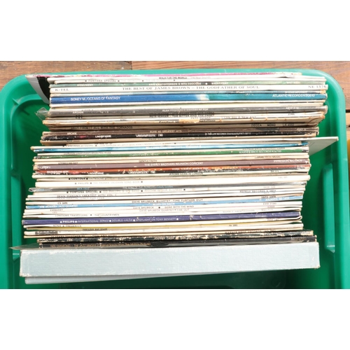 220 - Five boxes of LP and single records. Includes Blondie, Eric Clapton, The Swing Era box sets etc.