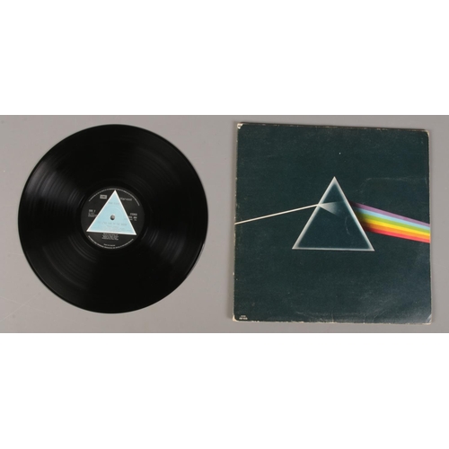 3 - A Pink Floyd Dark Side of the Moon LP record, first pressing with solid light blue triangle label.