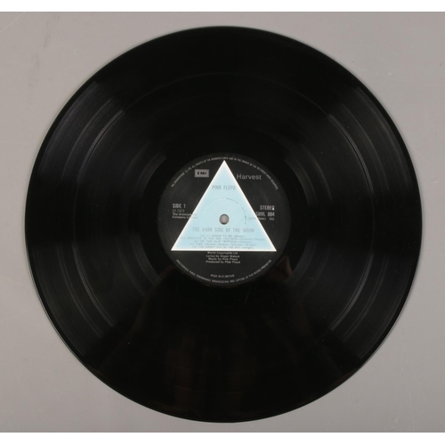 3 - A Pink Floyd Dark Side of the Moon LP record, first pressing with solid light blue triangle label.