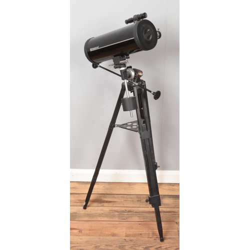 284 - A Tasco telescope. On tripod stand.