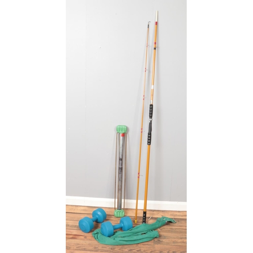 285 - A collection of sporting equipment. Includes Marco fishing rod, weights and tension bar.