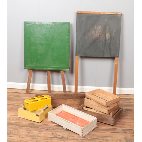 294 - Two vintage easels/chalk boards along with a collection of wooden trays and concrete moulds.