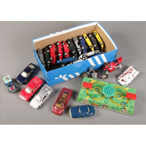 74 - A box of mainly diecast vehicles, includes WV tin plate toy.