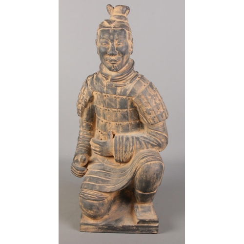 90 - A Chinese terracotta army seated figure. (61cm x 30cm)