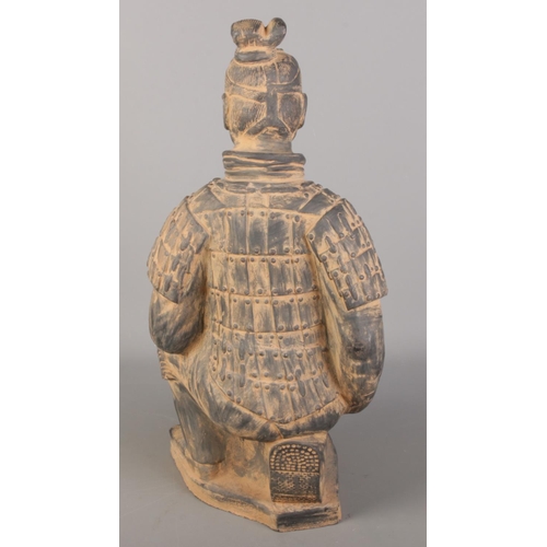 90 - A Chinese terracotta army seated figure. (61cm x 30cm)