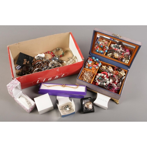 96 - A box of costume jewellery. Includes Pandora style bracelets, necklaces, earrings etc.