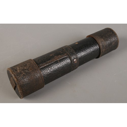 169 - A leather bound metal four drawer telescope.