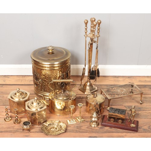 219 - A box of brassware. Including Eastern tea caddy, ornate bin, kettle, etc.