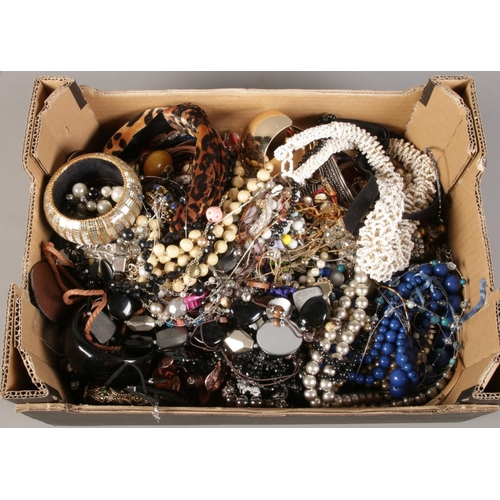 178 - A box of costume jewellery. Including beads, bangles, necklaces, bracelets, etc.