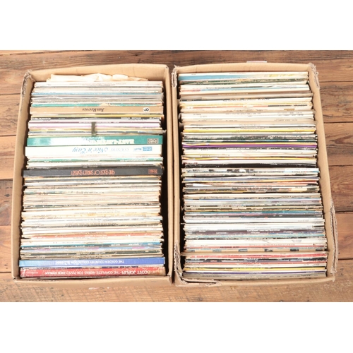 213 - Four large boxes of assorted vinyl records, to include UB40, Lionel Richie, Rod Stewart, Art Garfunk... 