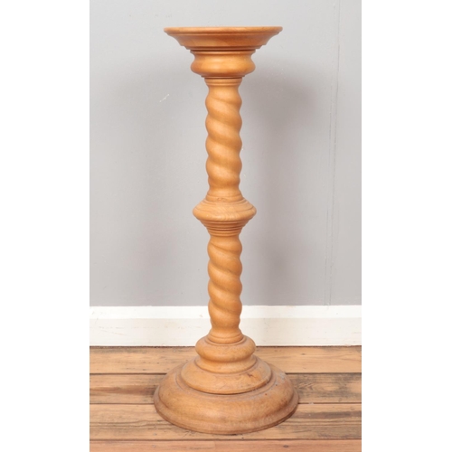 289 - A large modern torchiere with turned column and stepped base, together with an oriental transfer pri... 