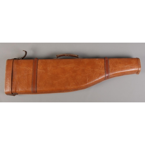 302 - A brown leather shoulder of mutton gun case, with carry handle. 78cm long.