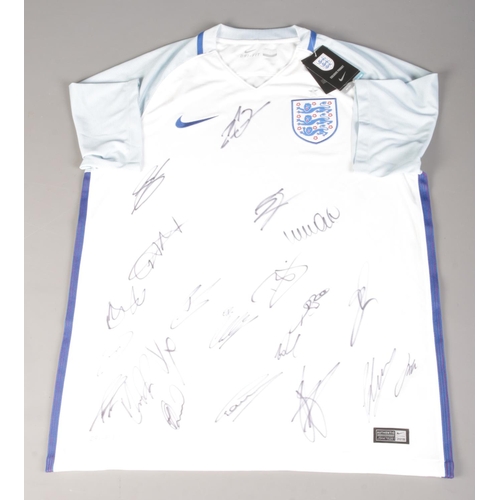 46 - A 2017 England Football Team signed shirt, with certificate and matching Vauxhall notebook. Signatur... 