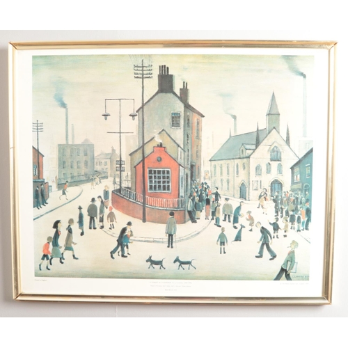 318 - After LS Lowry (1887-1976); A large framed print depicting 'A Street In Clitheroe'. Printed by the M... 