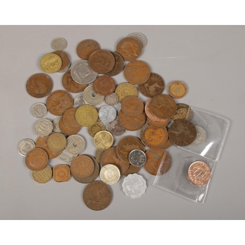 348 - A 1932 .900 silver cuban Peso, with milled edge, together with a collection of other coins including... 