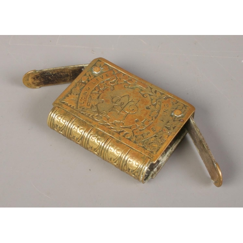 396 - A King George V double hinged brass vesta case, inscribed 'Long Live the King' together with novelty... 