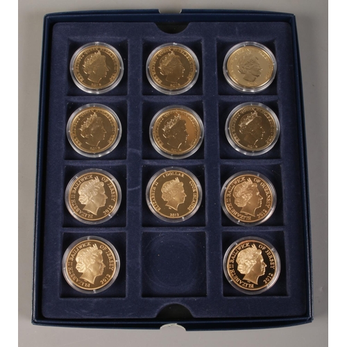 411 - A collection of eleven 24ct gold plated coins, from The London Mint Office and Westminster Collectio... 