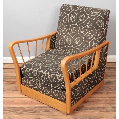 455 - A mid-twentieth century beech framed metamorphic reclining chair/bed.