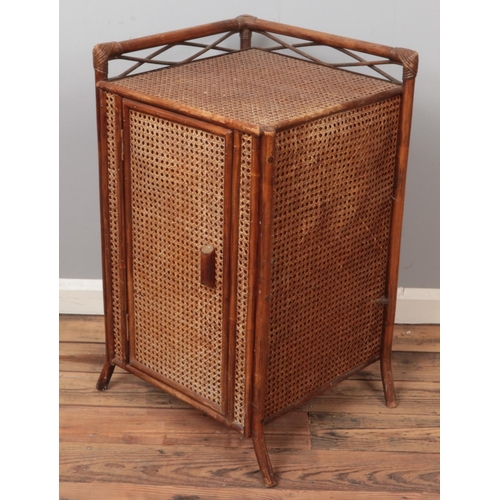 457 - A bamboo and bergère corner unit. (79cm x 45cm x 45cm)