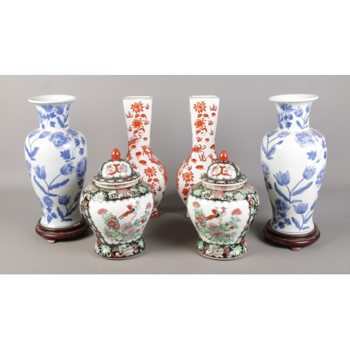 91 - Three pairs of oriental vases, to include large blue and white baluster and lidded examples. Marks t... 