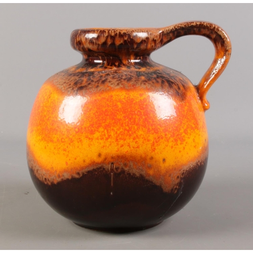 95 - A large West German handled lava vase, shape 484-21, in brown and orange/red. Height: 22cm, Width: 2... 