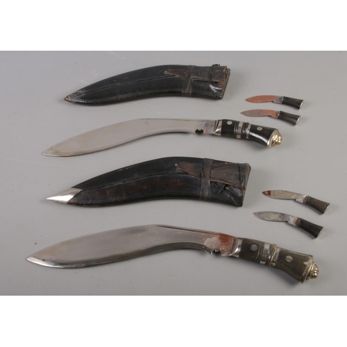 497 - Two Kukri knives in scabbards. 46cm length.