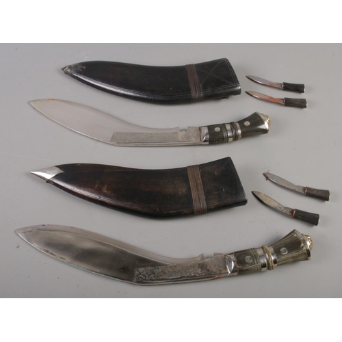 497 - Two Kukri knives in scabbards. 46cm length.