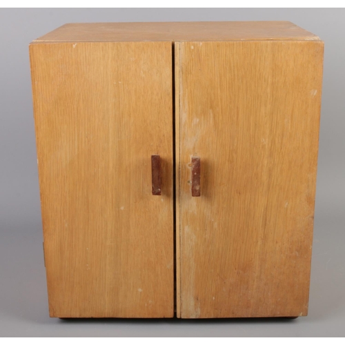 2 - An oak and ply coin chest of drawers.