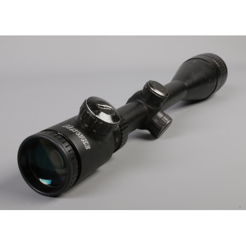 20 - A Hawke AO6.5-20X50IR nite-eye long range rifle scope, complete with spare battery.