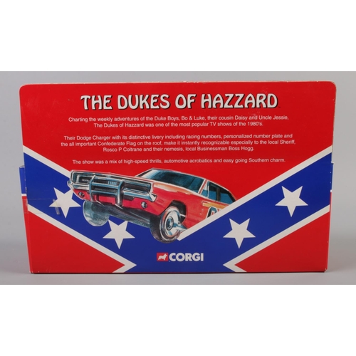 25 - Corgi - A Dukes of Hazzard set consisting of a 1:36 scale Dodge Charger and hand painted white metal... 