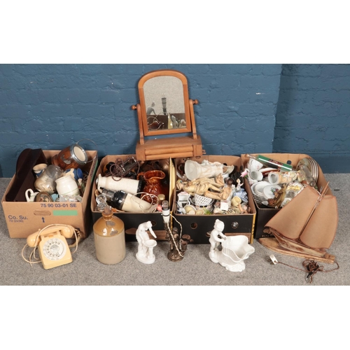 301 - Four boxes of miscellaneous. Including ceramic figures, wall clock, rotary dial telephone, toilet mi... 