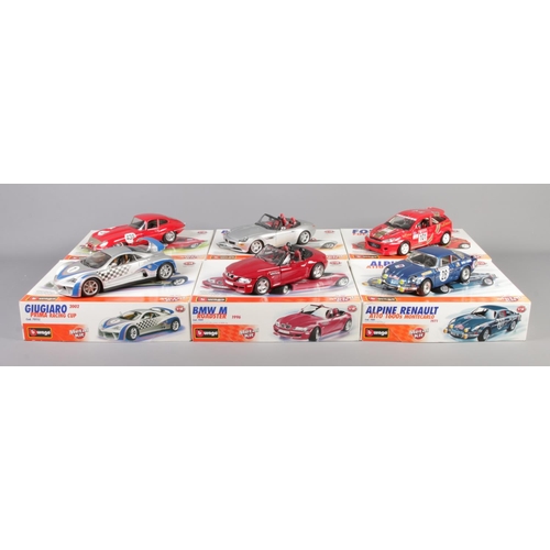 311 - A set of six boxed Burago metal kit scale models. To include 2000 BMW Z8 (1/18), 1961 Jaguar E Coupe... 