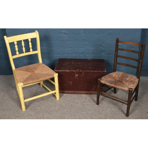 325 - Two child's chair with rush seats along with a small wooden tool chest.