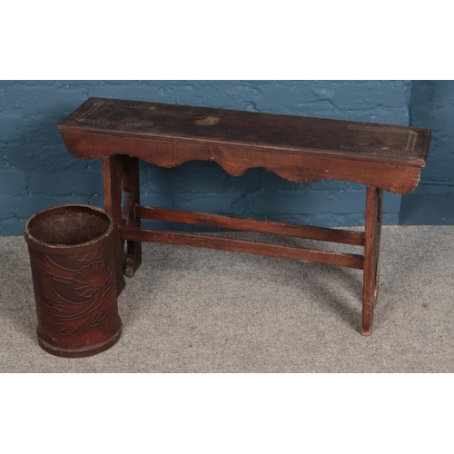 345 - A carved wooden bench along with a leatherette bin.