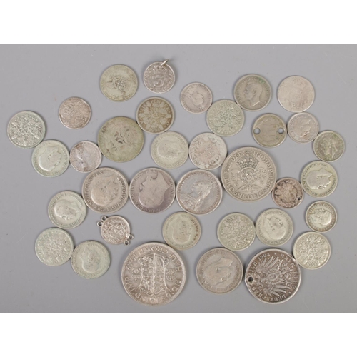 450 - A collection of mainly British pre decimal coins; pre 1947 silver examples including Victorian.