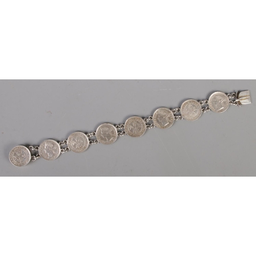 459 - A silver coin bracelet made up of Hong Kong 1891 Five Cent coins.