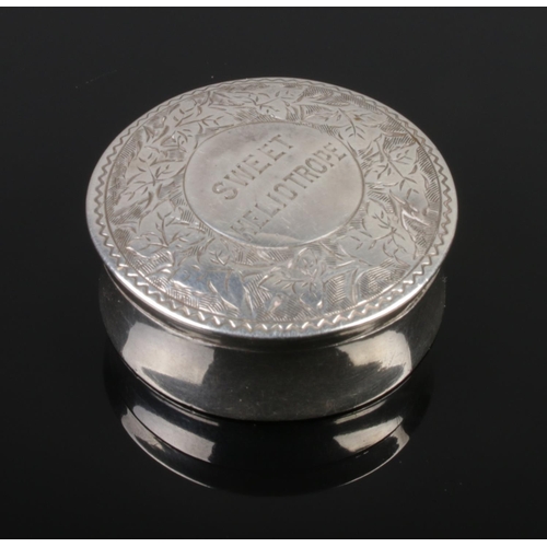 465 - A Victorian silver pill box engraved to the top 