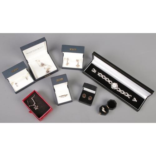 472 - A collection of boxed silver jewellery. Includes Accurist wristwatch, earrings, necklace etc.