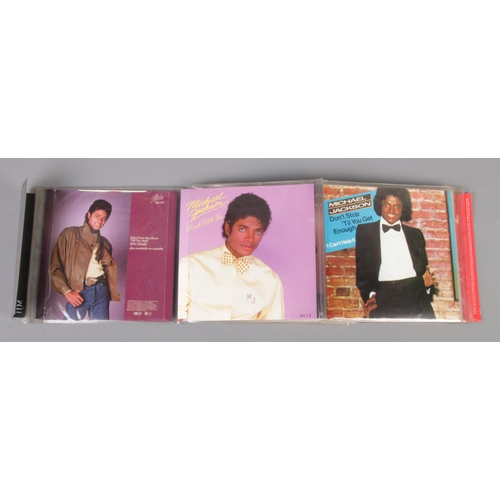 94 - Michael Jackson - 9 Singles Pack, on red vinyl.